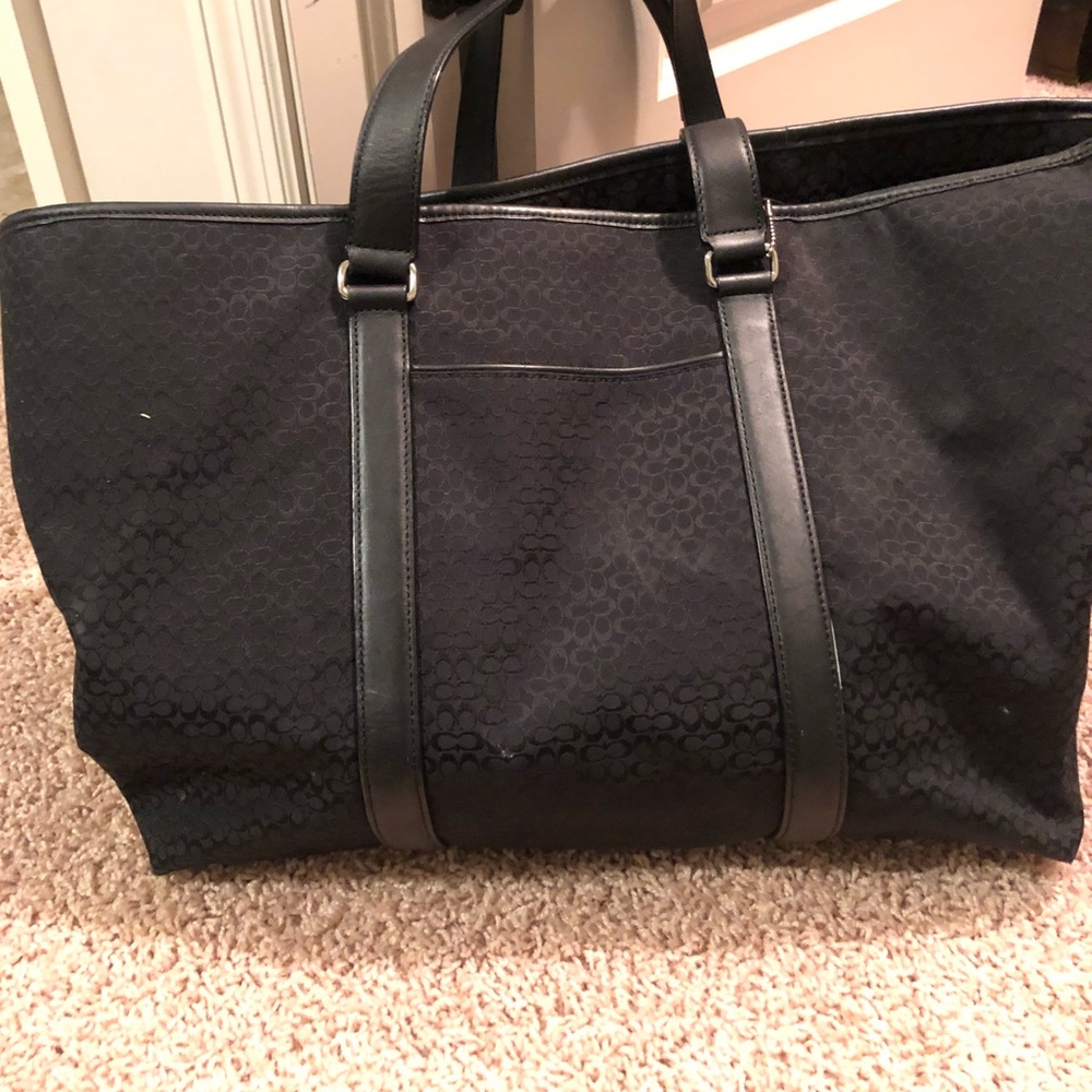 Black Coach weekender bag.